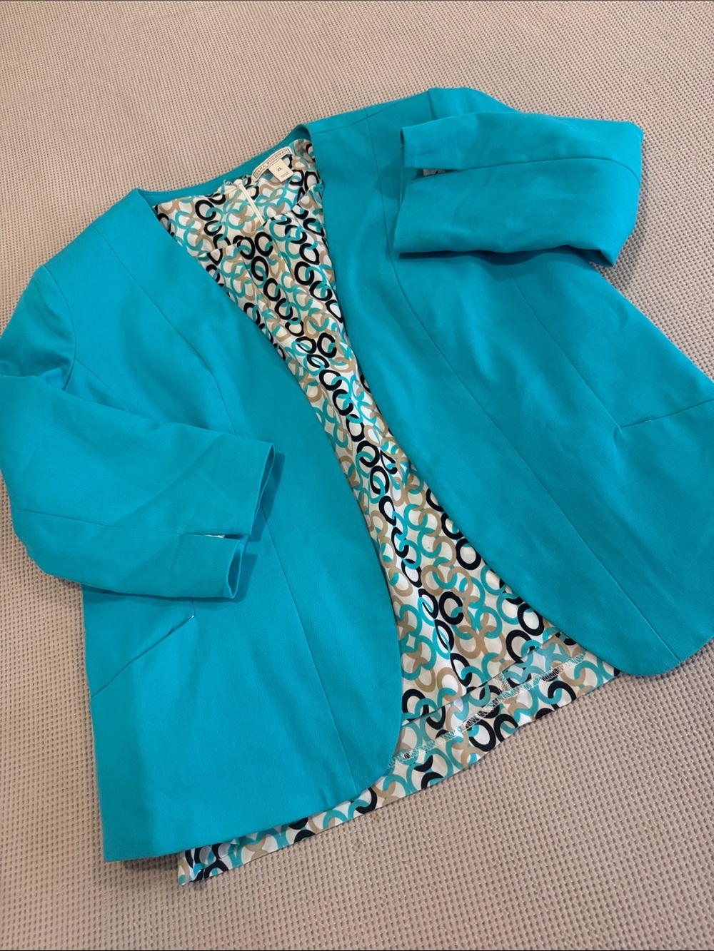 Turquoise Open-Front Women's Blazer with multicolor design blouse.